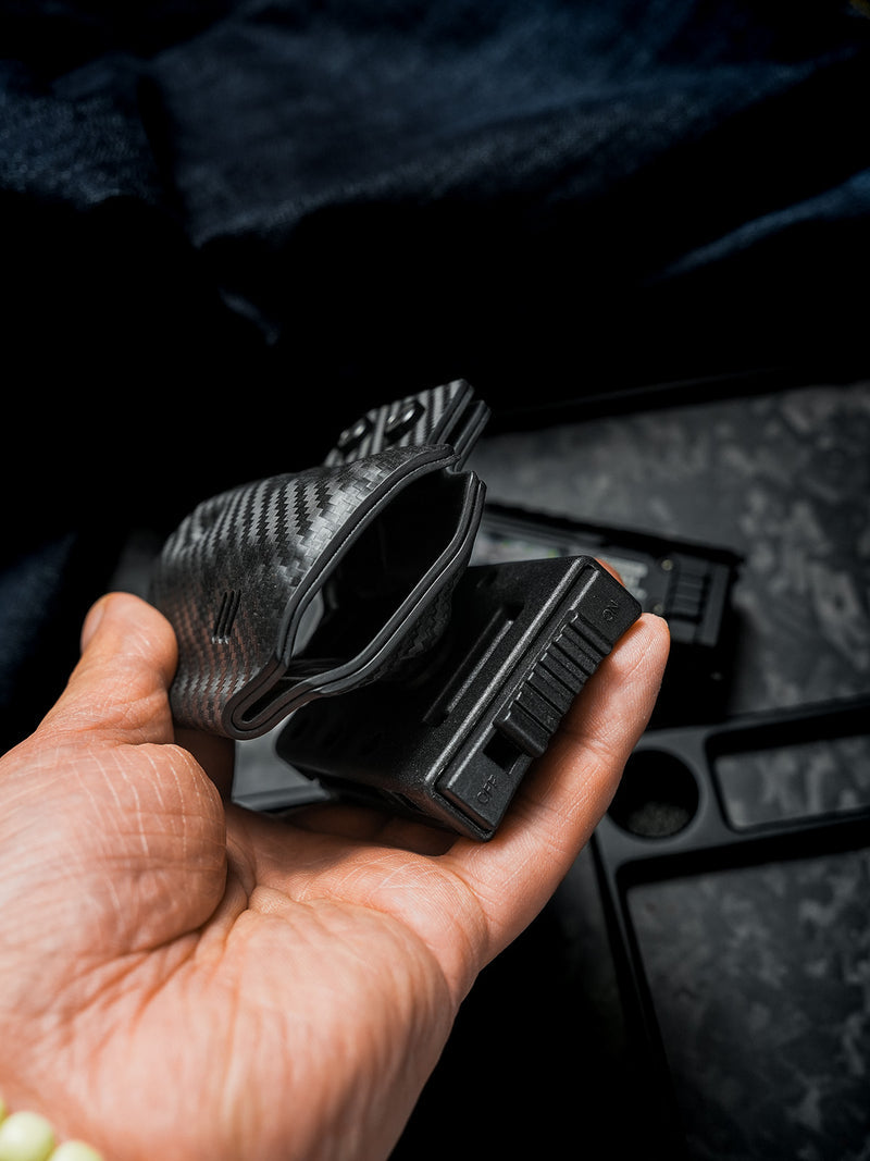 Bottom opening detail of the carbon fiber texture TACTICALGEEK TG TX13 KYDEX flashlight sheath