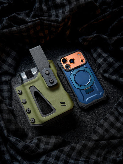 Flat lay of the olive green Single Skeleton Window phone case placed beside a smartphone, showing the front window opening and belt clip design.