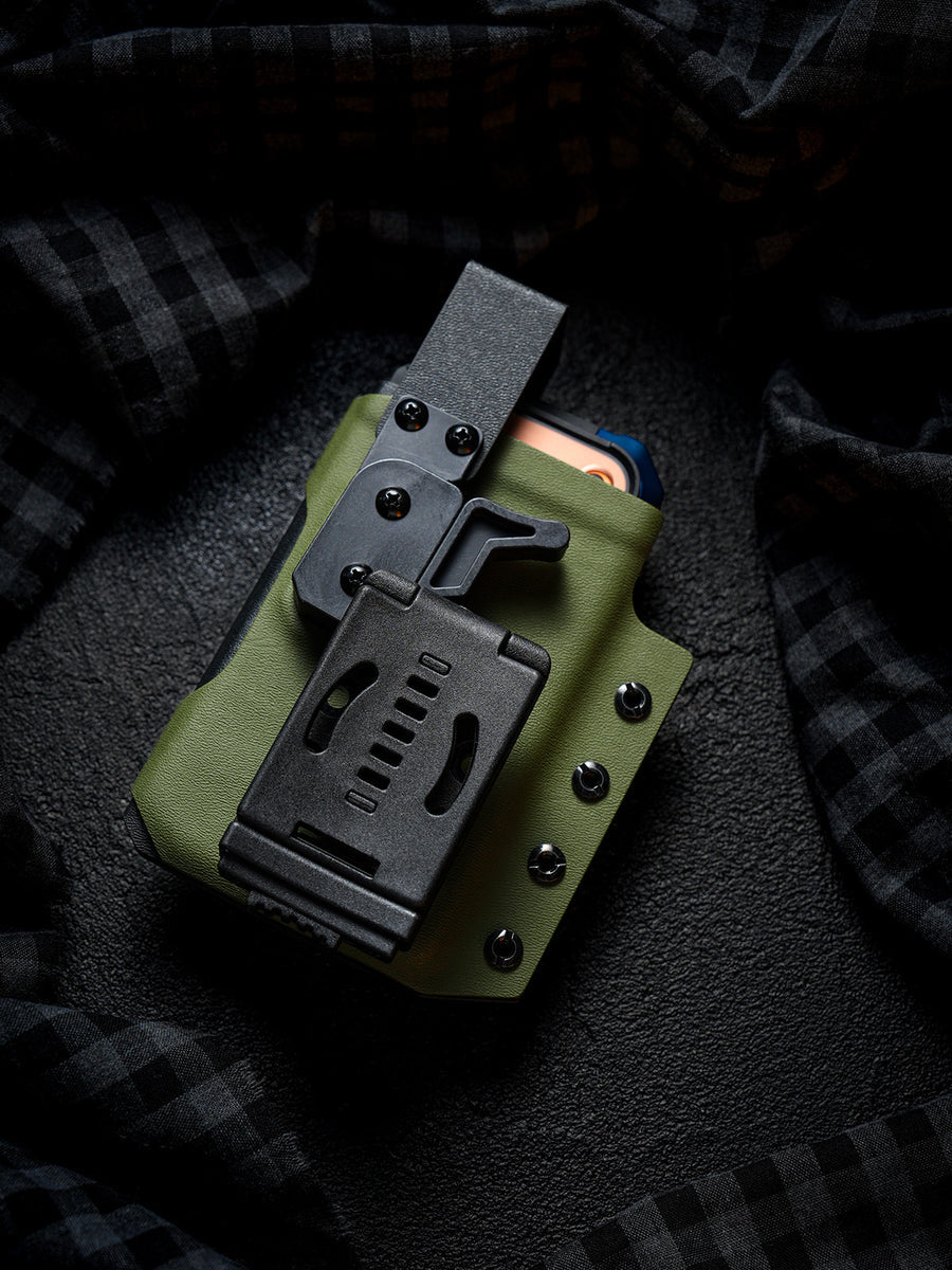 Rear view of the olive green Single Skeleton Window phone case with belt clip, shown with a smartphone partially inserted.