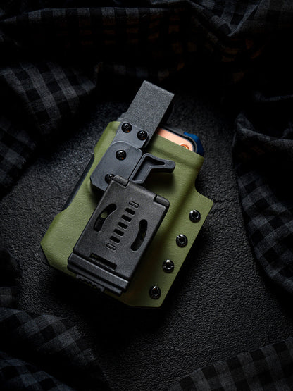 Rear view of the olive green Single Skeleton Window phone case with belt clip, shown with a smartphone partially inserted.