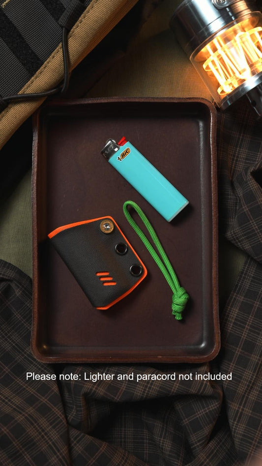 TACTICALGEEK black and orange Kydex sheath for BIC lighter with lanyard attachment holes, shown in an EDC lifestyle setup.