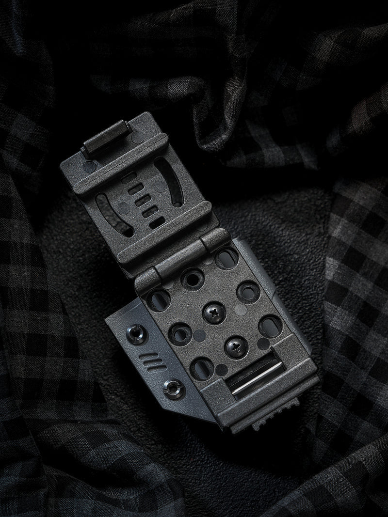 Open back view of the TACTICALGEEK TG TX13 KYDEX flashlight sheath showing the adjustable belt clip structure