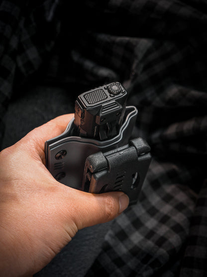 Handheld top view of the T style TACTICALGEEK TG TX13 flashlight sheath with belt clip