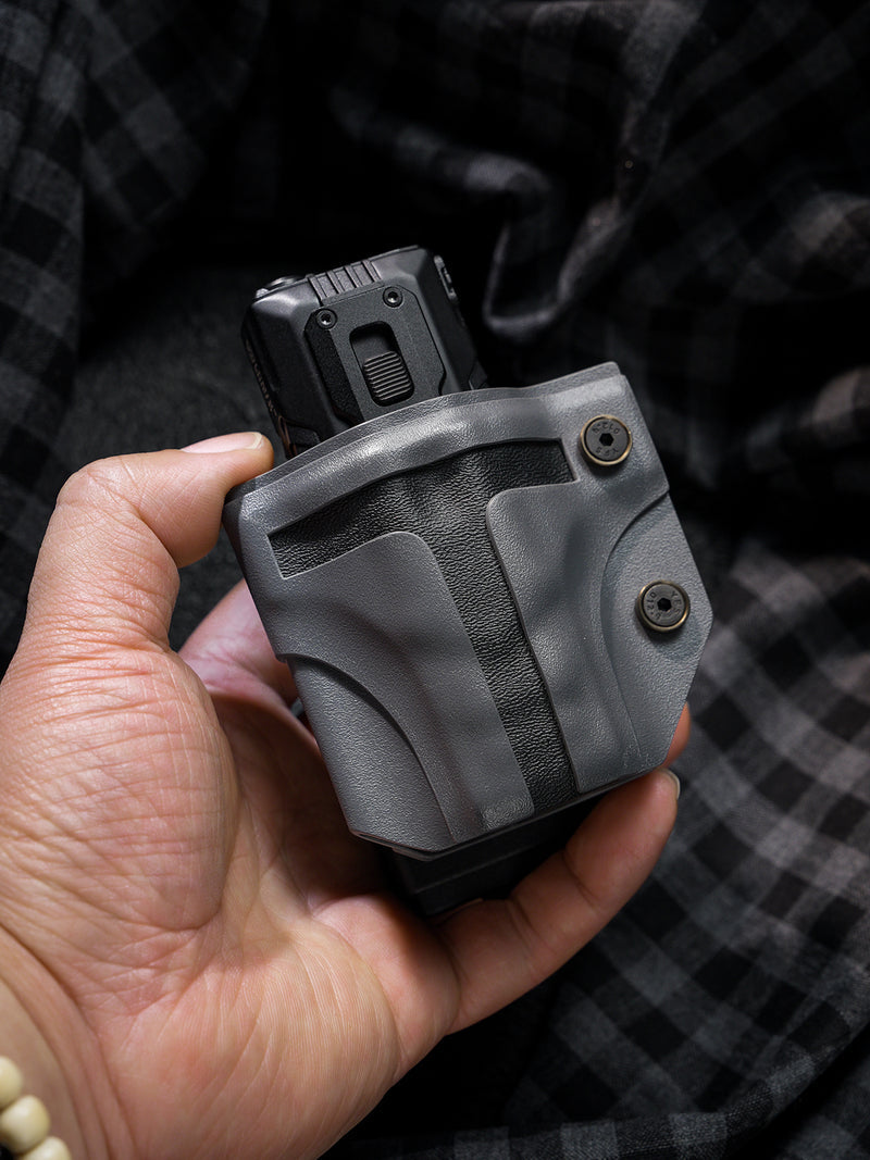 Handheld view of the T style TACTICALGEEK TG TX13 KYDEX flashlight sheath for NITECORE EDC37