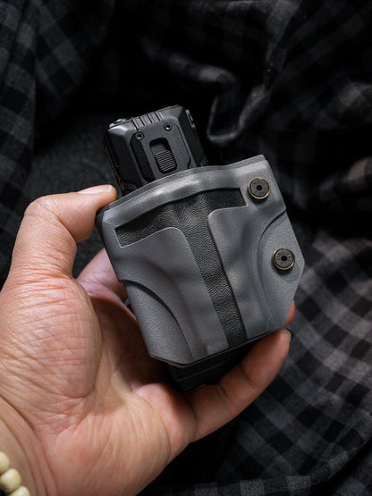 Handheld view of the T style TACTICALGEEK TG TX13 KYDEX flashlight sheath for NITECORE EDC37