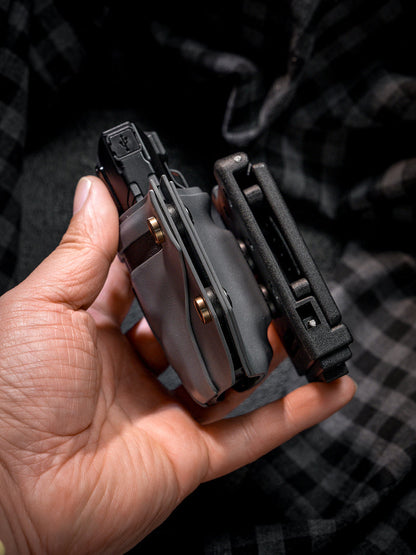 Handheld side view of the T style TACTICALGEEK TG TX13 KYDEX flashlight sheath with belt clip