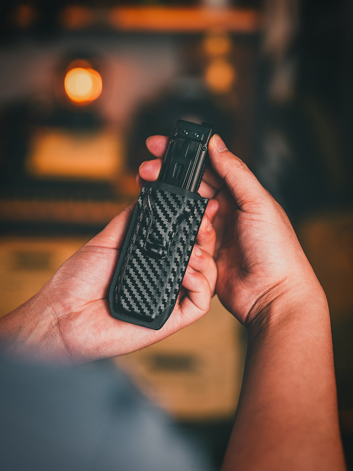 Handheld view of TG TX5 KYDEX EDC flashlight sheath for everyday carry