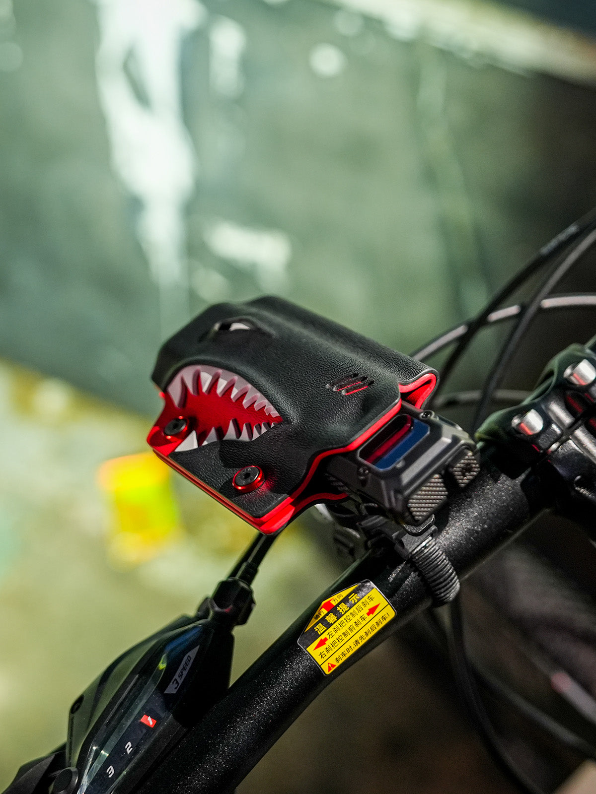 Shark-style TX10 flashlight sheath for Nitecore EDC29 mounted on a bicycle handlebar, shown from a front angled view.