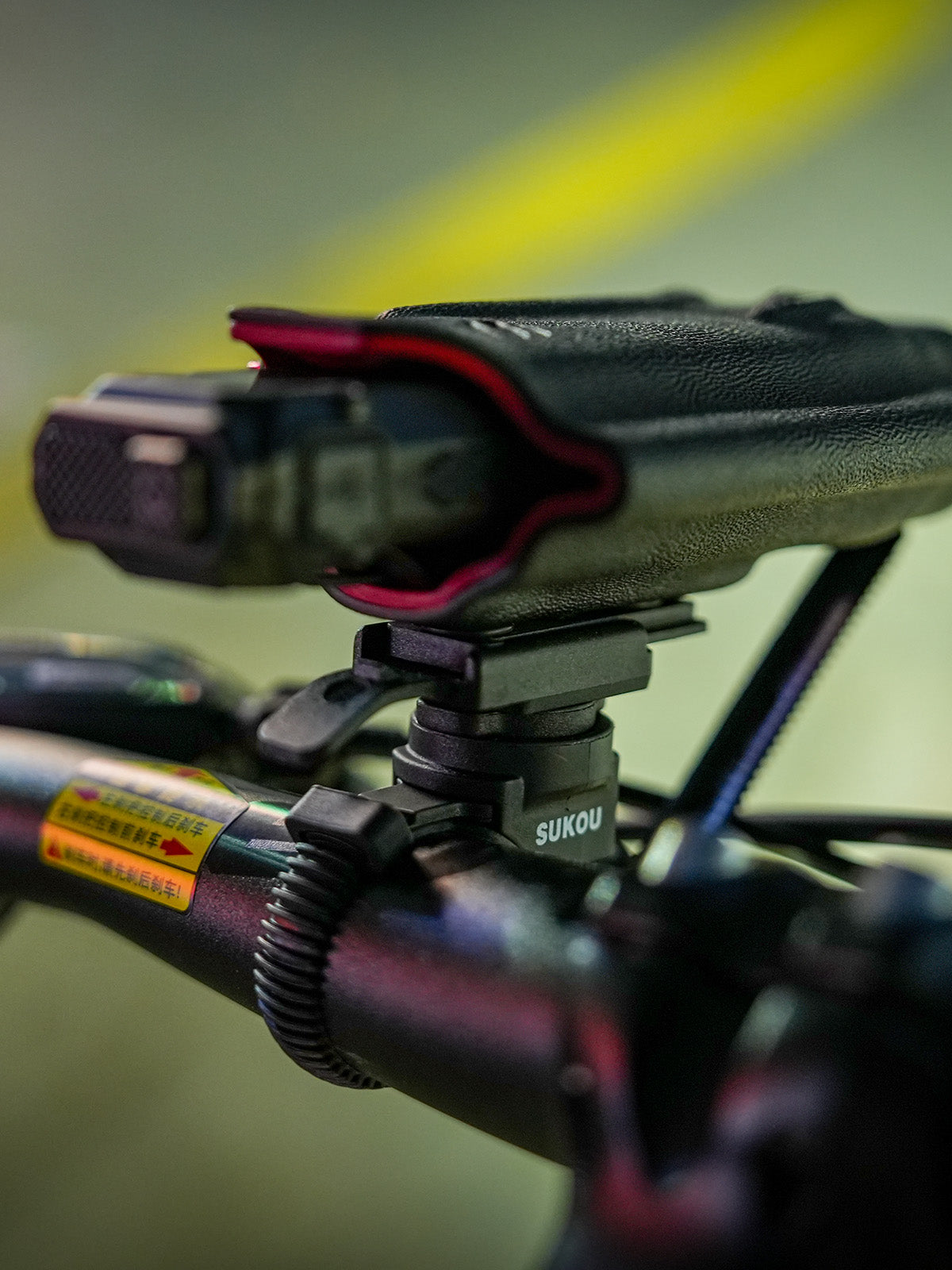 Rear opening view of the TX10 flashlight sheath for Nitecore EDC29 mounted on a removable bicycle clamp.