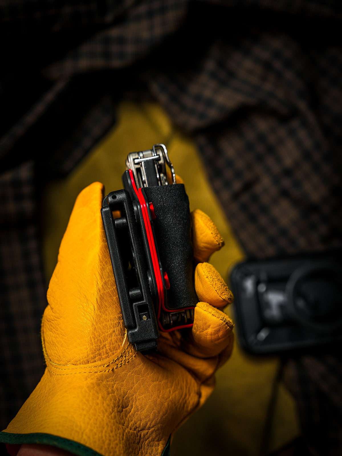 Side profile of the shark-style TX15 multi-tool sheath for Leatherman Charge, showing the attached belt clip and tool fit