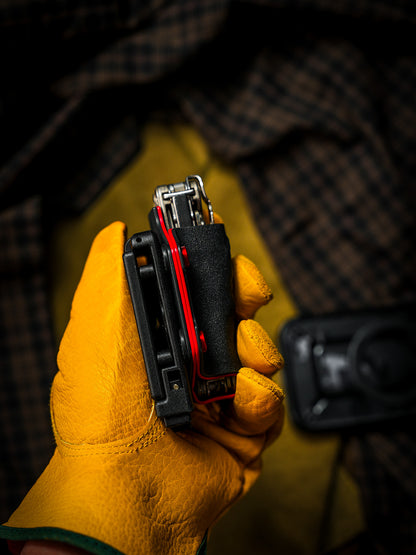 Side profile of the shark-style TX15 multi-tool sheath for Leatherman Charge, showing the attached belt clip and tool fit