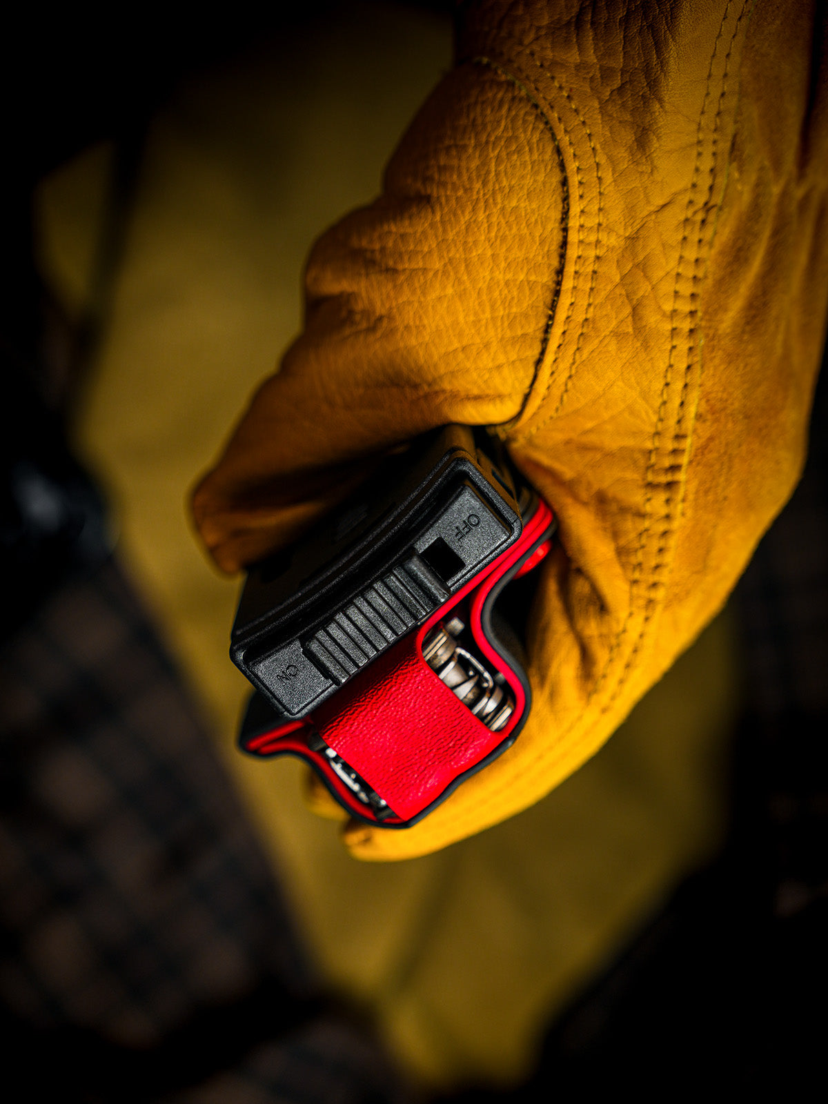 Top opening view of the shark-style TX15 multi-tool sheath for Leatherman Charge, highlighting the belt clip and tool access.