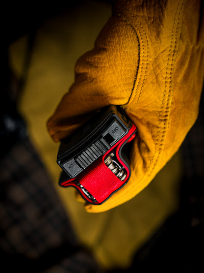 Top opening view of the shark-style TX15 multi-tool sheath for Leatherman Charge, highlighting the belt clip and tool access.