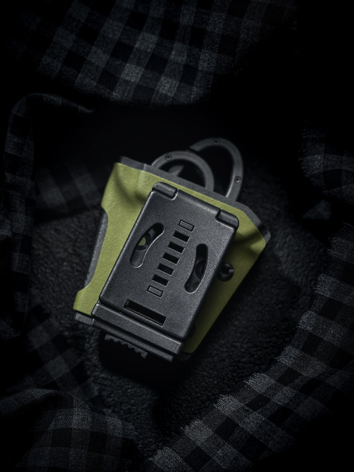 Back view of the TACTICALGEEK TX18 Multi-Tool Sheath for SOG ParaShears in green colorway, showing the belt clip on the rear side.