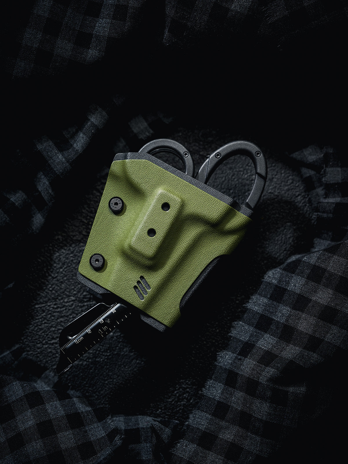 TACTICALGEEK TX18 Multi-Tool Sheath for SOG ParaShears in green colorway with the ruler tool extended from the ParaShears.