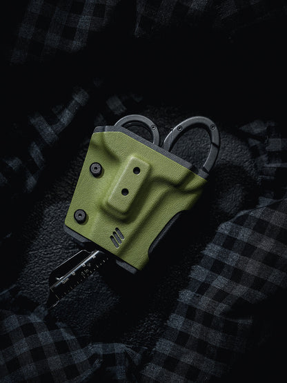 TACTICALGEEK TX18 Multi-Tool Sheath for SOG ParaShears in green colorway with the ruler tool extended from the ParaShears.