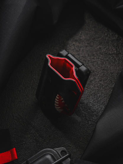 TACTICALGEEK TX9 flashlight sheath for Nitecore EDC27 showing the top opening and inner red lining.