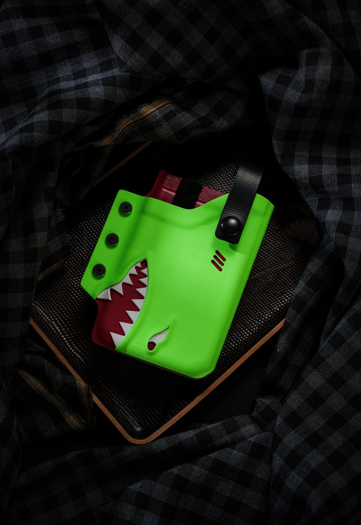 Back strap view of the neon green TACTICALGEEK TG EDC KYDEX shark phone sheath for iPhone 17 Pro Max.