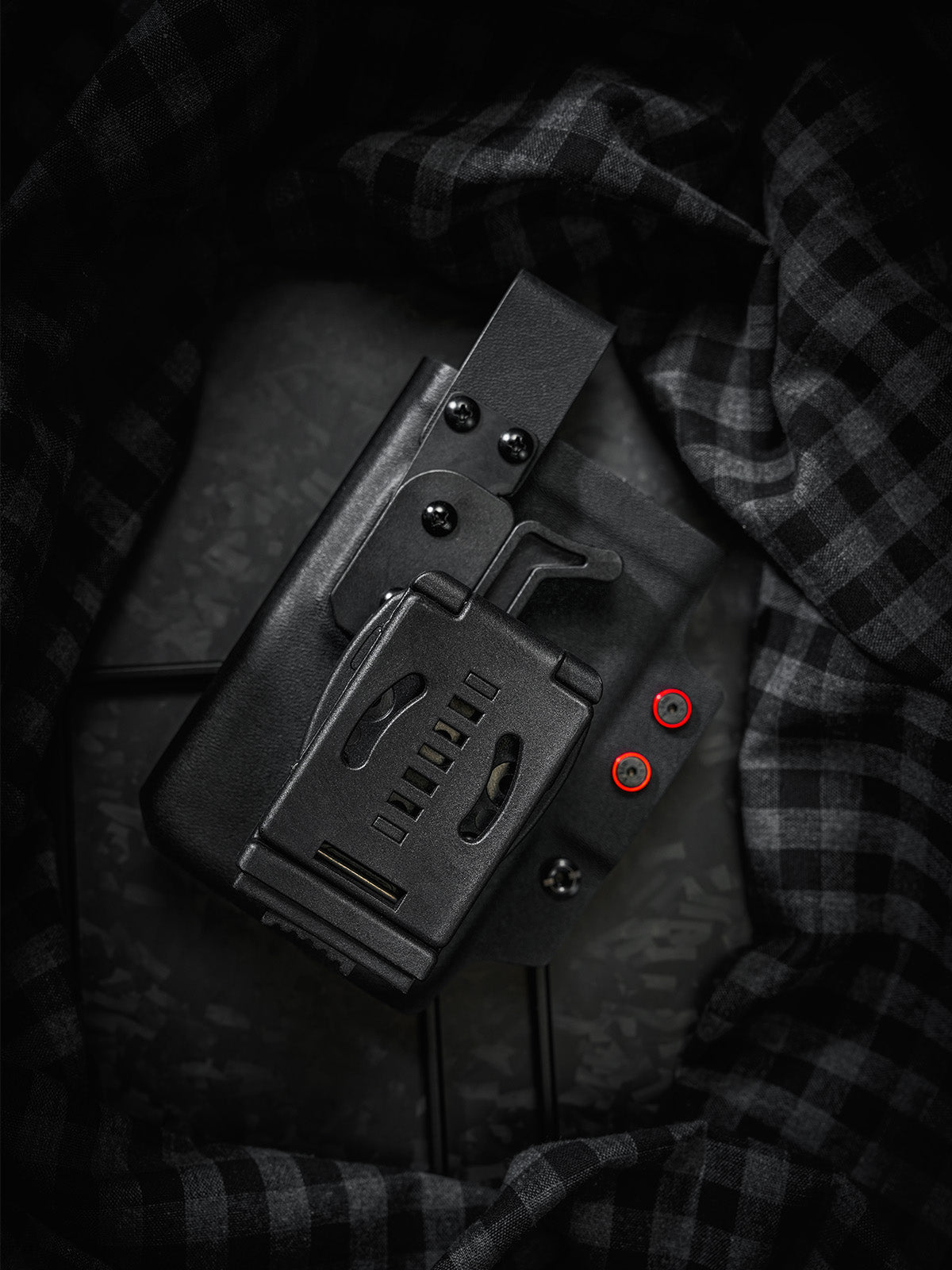Rear view of the black and red TACTICALGEEK TG EDC KYDEX shark phone sheath showing the belt clip attachment and back structure.