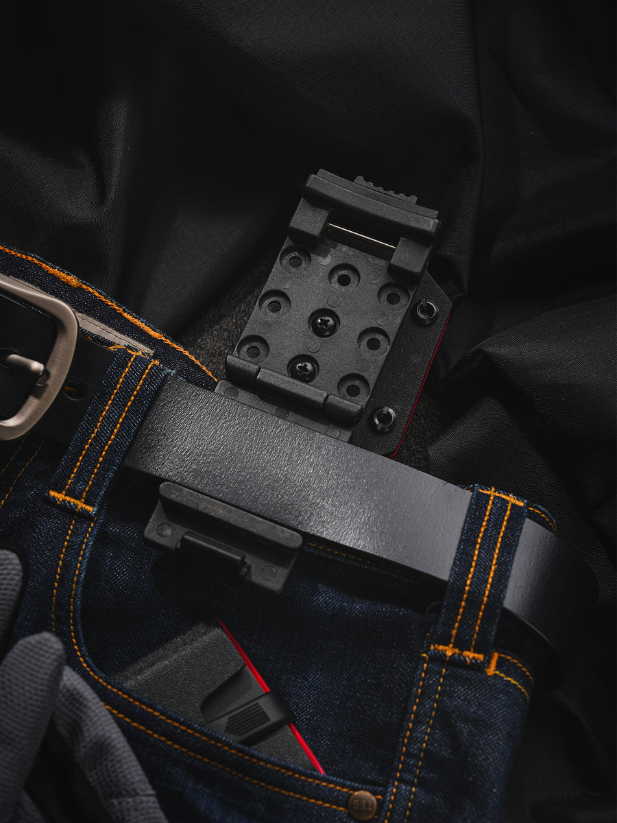 Shark-style TX10 Flashlight Sheath with the clip assembly opened to show the mounting plate and attachment structure.
