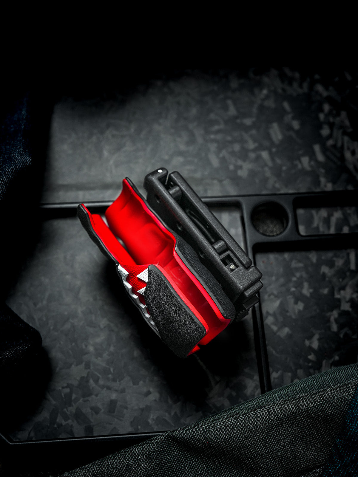 Empty TX22 shark-style flashlight sheath for Nitecore P20ix shown from the side, highlighting the red interior and belt clip structure.