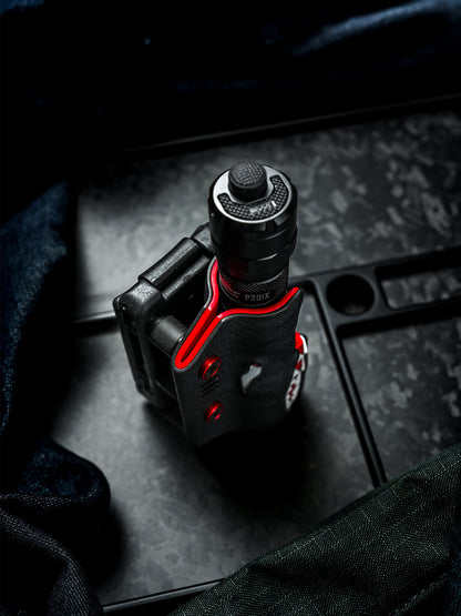 Front view of the TX22 shark-style flashlight sheath for Nitecore P20ix, shown with the flashlight inserted and a belt clip attached on the side.